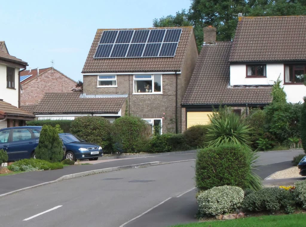 Suburban house with a solar array on the front roof slope